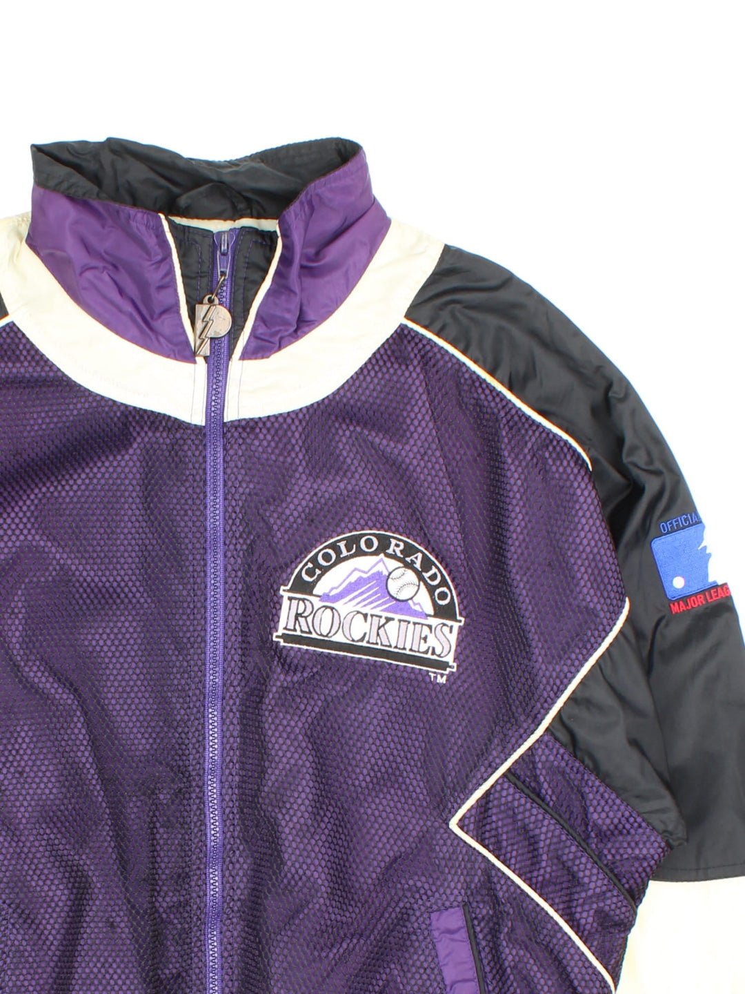 90s Pro Player Colorado Rockies MLB zip-through windbreaker jacket in purple with black and white panelling, two pockets, a branded 'P' zip pull, and embroidered logos on the front, back, and sleeves.