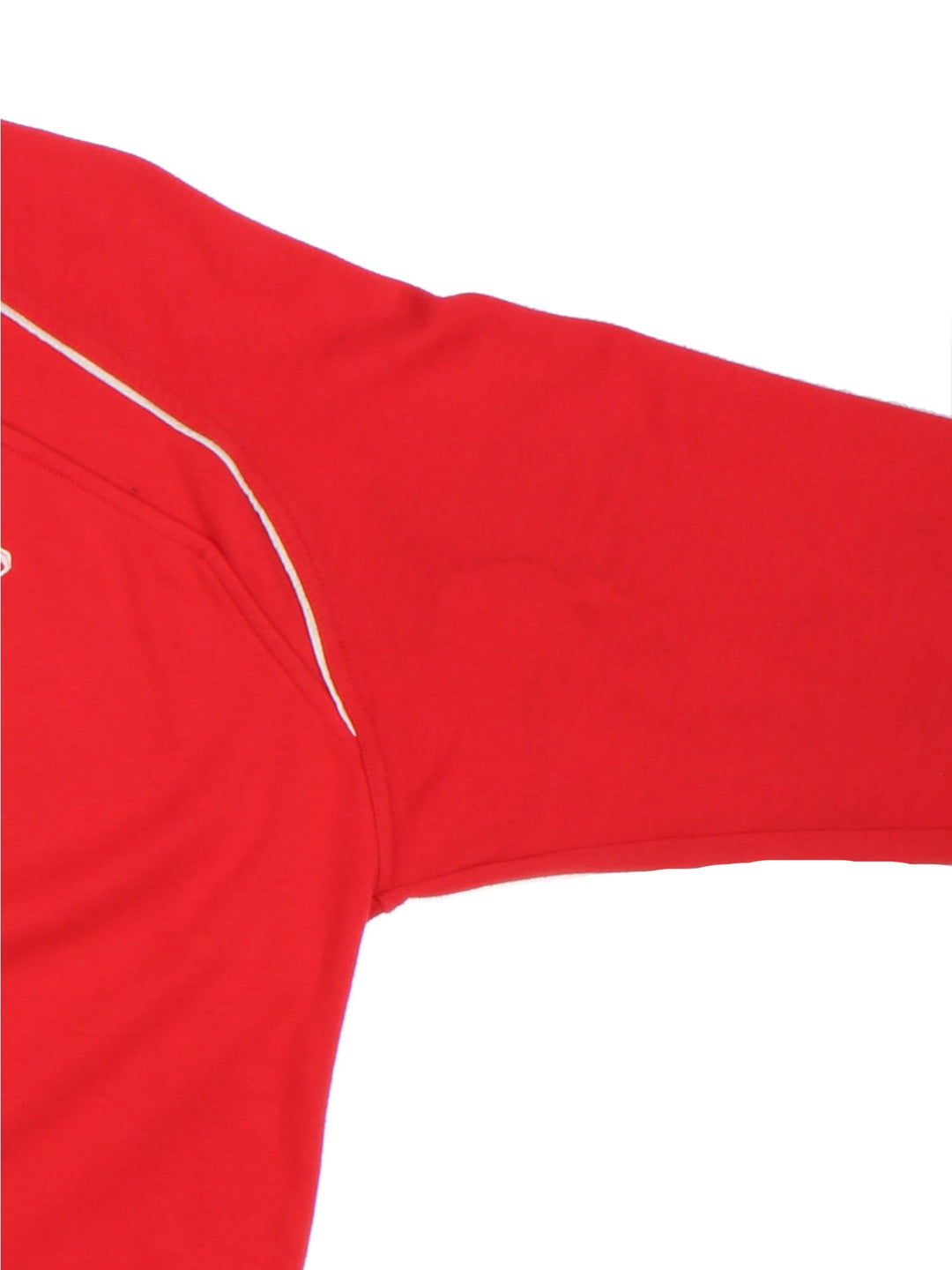 Reebok 2007/08 Wales Rugby Union shirt in red with 2 buttons at the collar, white piping, and printed and embroidered team and sponsor logos on the front.