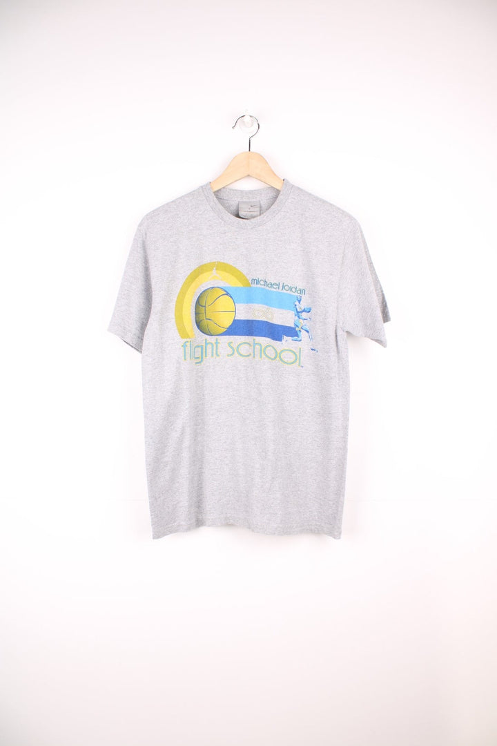 Michael Jordan flight school 06 Nike T-Shirt in grey, blue and yellow with print across the chest. 