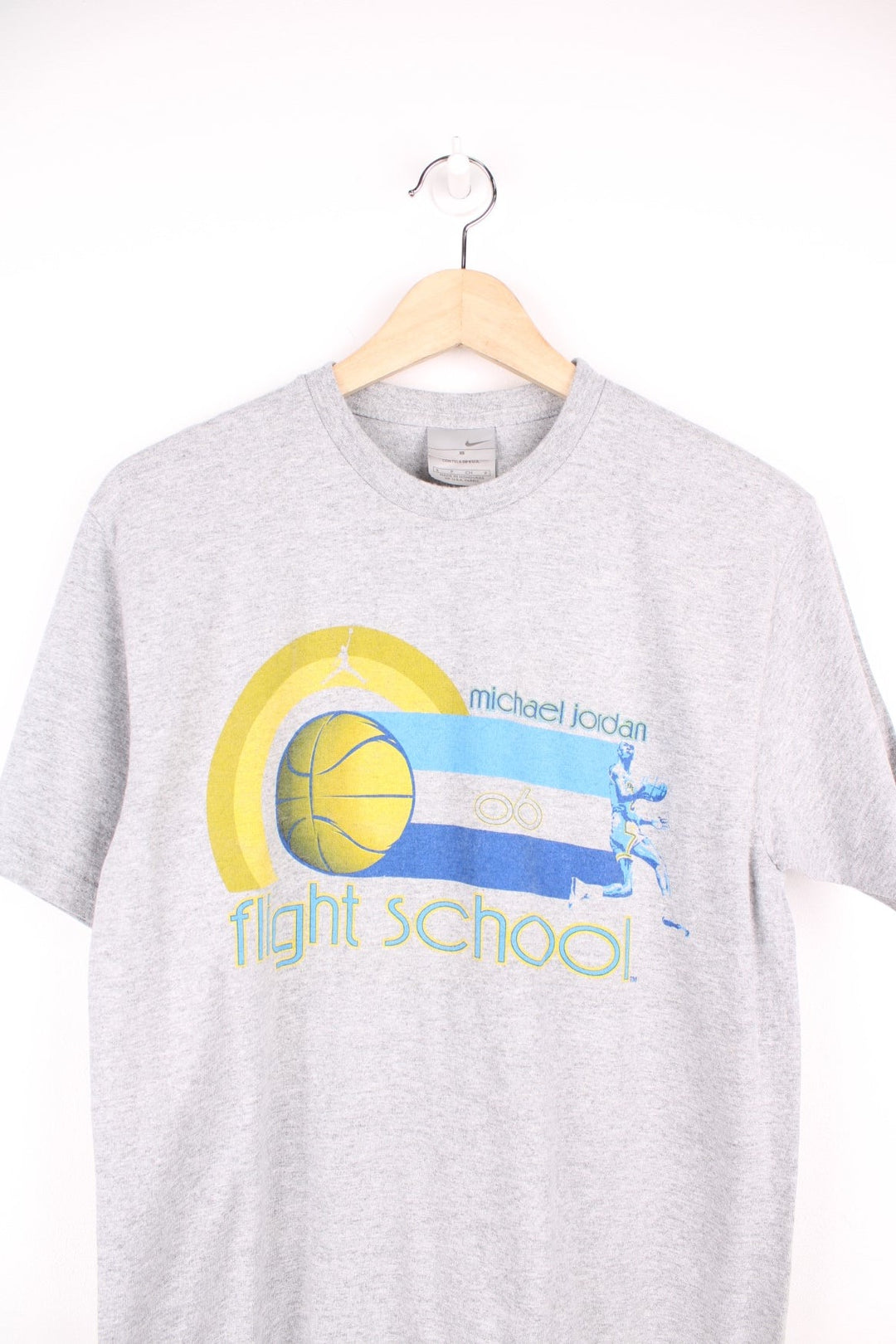 Michael Jordan flight school 06 Nike T-Shirt in grey, blue and yellow with print across the chest. 