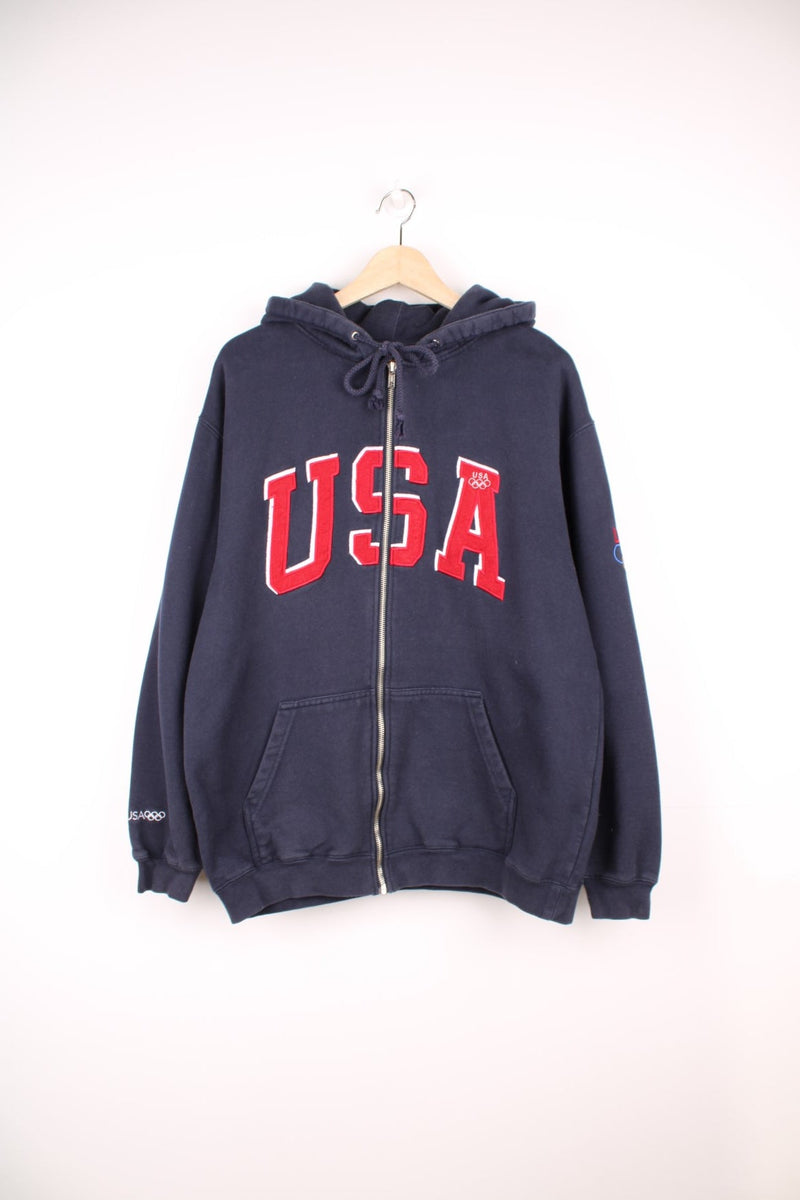 Team USA blue zip through hoodie with red embroidered "USA" across the chest and olympic rings on the sleeve.