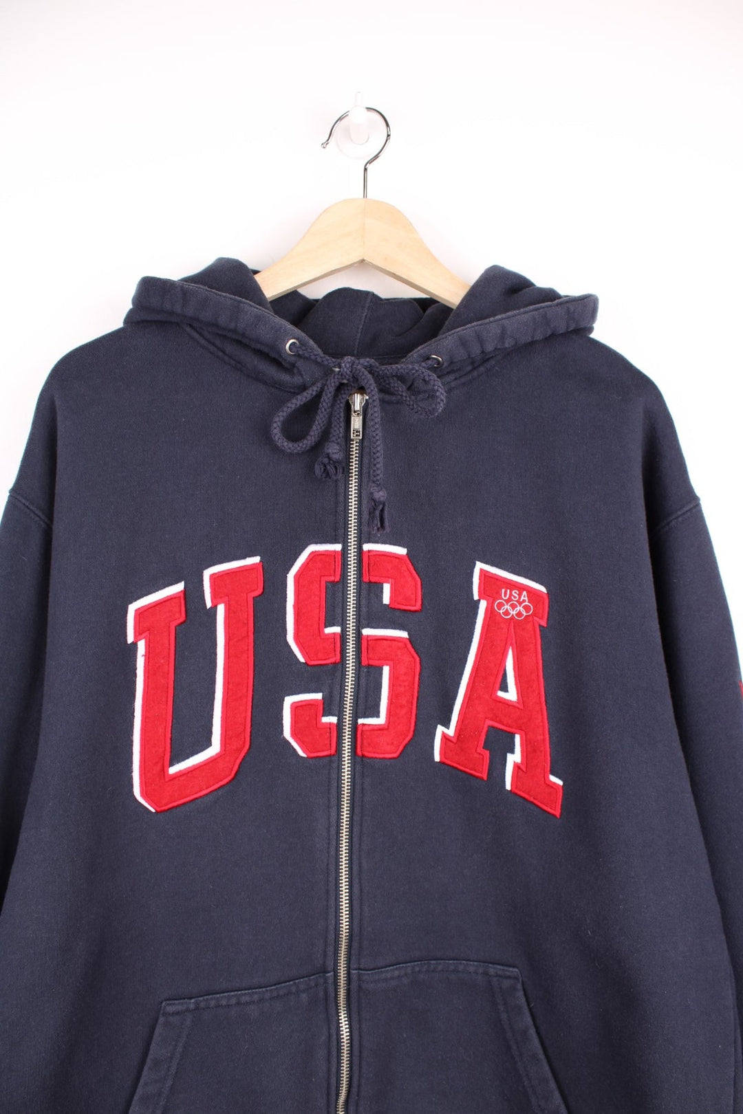 Team USA blue zip through hoodie with red embroidered "USA" across the chest and olympic rings on the sleeve.