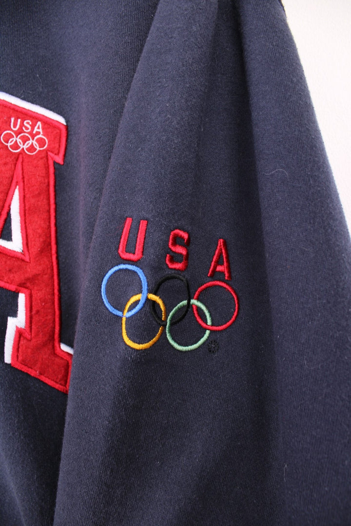 Team USA blue zip through hoodie with red embroidered "USA" across the chest and olympic rings on the sleeve.