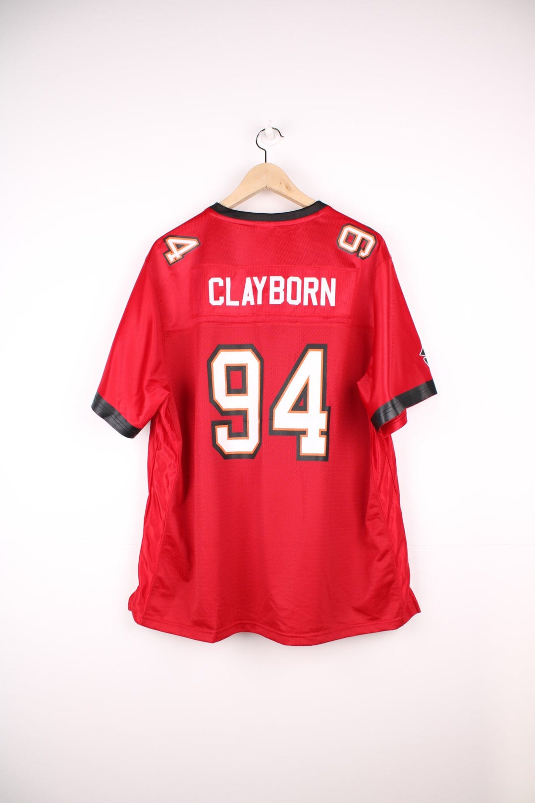 NFL Tampa Bay Buccaneers Shirt in a red colourway, Adrian Clayborn number 94 printed on the back, and has the logos printed on the front. 