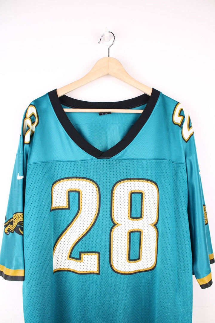 Jacksonville Jaquars Nike Jersey in a blue, white, and black colourway, Fred Taylor number 28 printed on the back, and has the logos printed on the sleeves. 