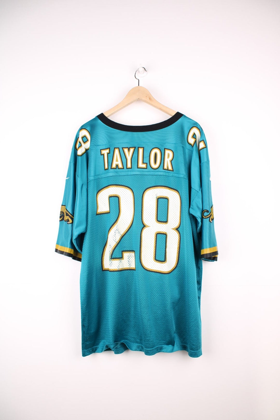 Jacksonville Jaquars Nike Jersey in a blue, white, and black colourway, Fred Taylor number 28 printed on the back, and has the logos printed on the sleeves. 