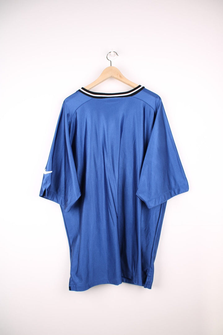 Nike Duke Blue Devils University Basketball Training Top in a blue, black and white colourway, v neck and has the logo embroidered on the front. 