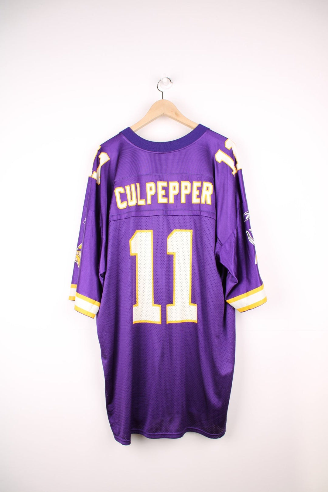 NFL Minnesota Vikings Jersey in a purple colourway, Duante Culpepper number 11 printed on the back, and has the logos printed on the front and sleeves. 