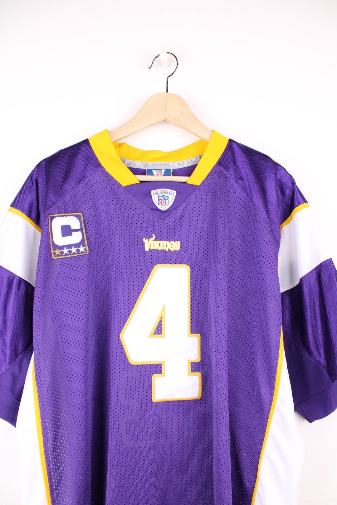 NFL Minnesota Vikings Jersey in a purple colourway, Brett Favre number 4 embroidered on the back, and has the logos on the front and sleeves. 