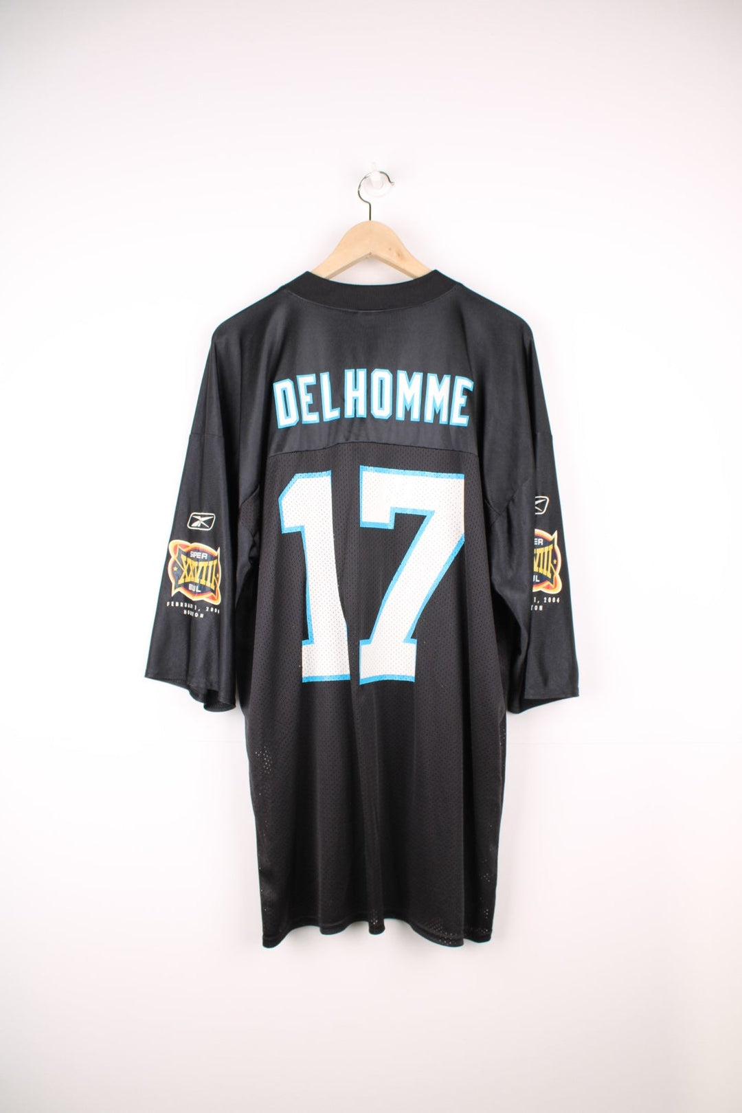 NFL Carolina Panthers Super Bowl 2004 Jersey in a black colourway, Jake Delhomme number 17 printed on the back, and has the logos on the sleeves. 