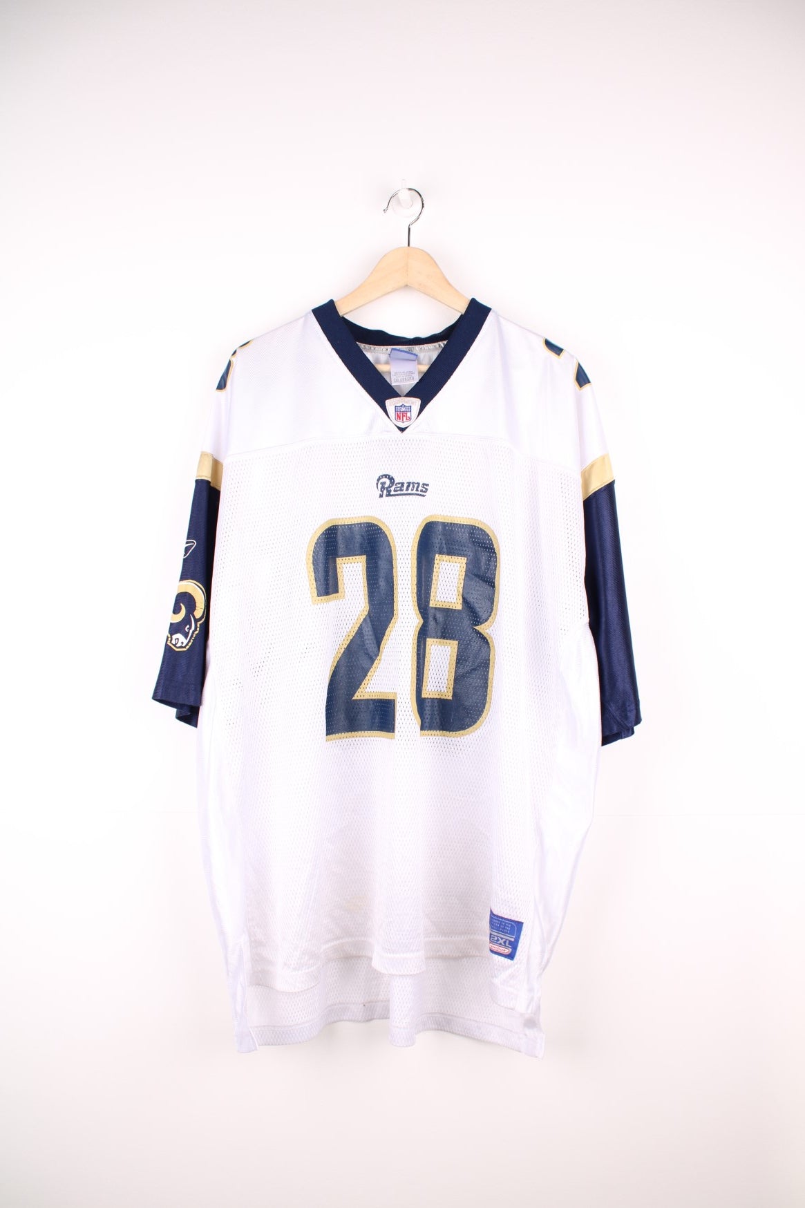 St. Louis Rams NFL Jersey in a white, blue and gold colourway, Marshall Faulk number 28 printed on the back, and has the logos on the front and sleeves. 