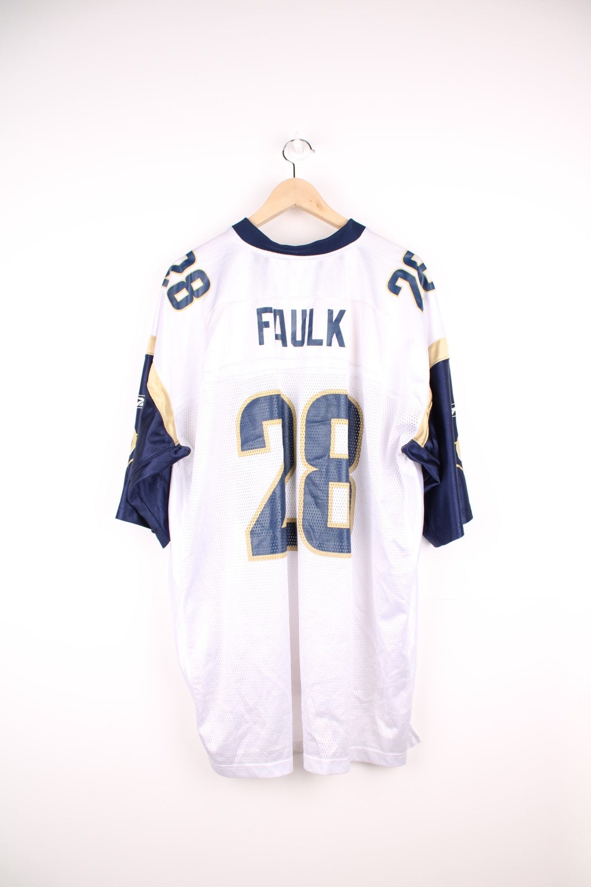 St. Louis Rams NFL Jersey in a white, blue and gold colourway, Marshall Faulk number 28 printed on the back, and has the logos on the front and sleeves. 