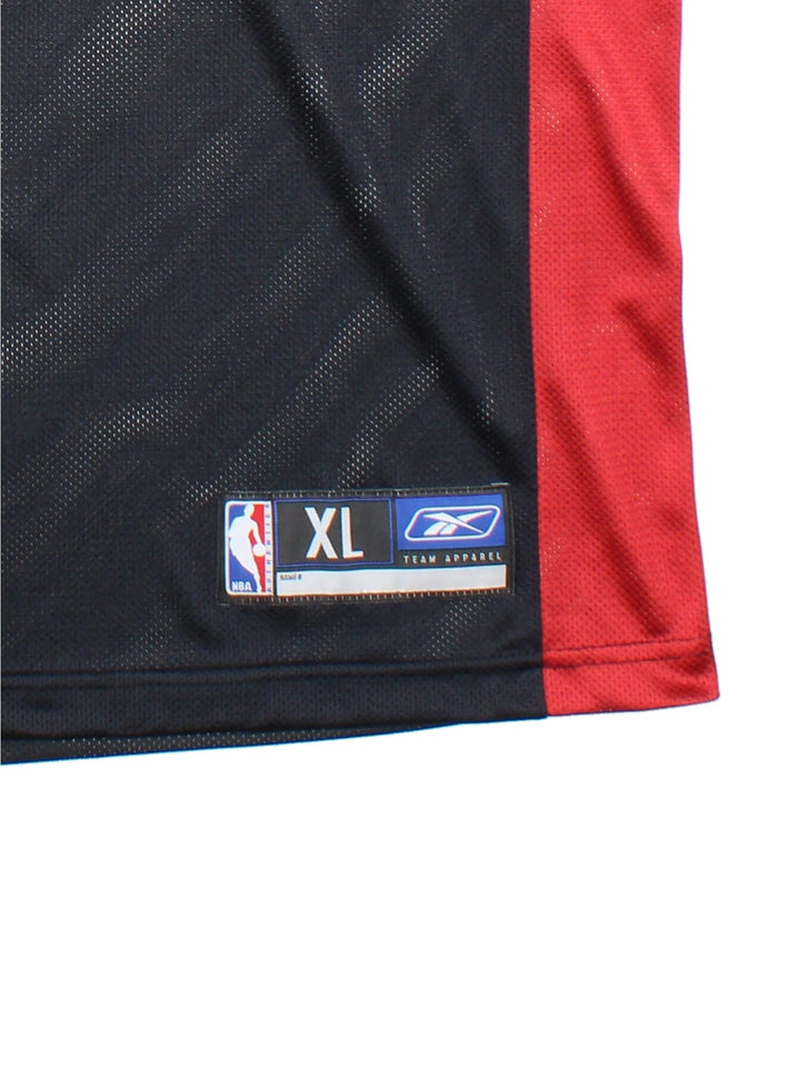 Miami Heat Reebok NBA Jersey in the black away kit colourway with red detailing. #32 Shaq O'Neal on the back with the team logo on front