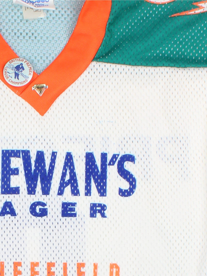 Vintage Sheffield Steelers Ice Hockey Jersey in the white colourway, features large logo and graphic and badge on the front. Two vintage 90's badge pins attached to collar and player name and number on back.