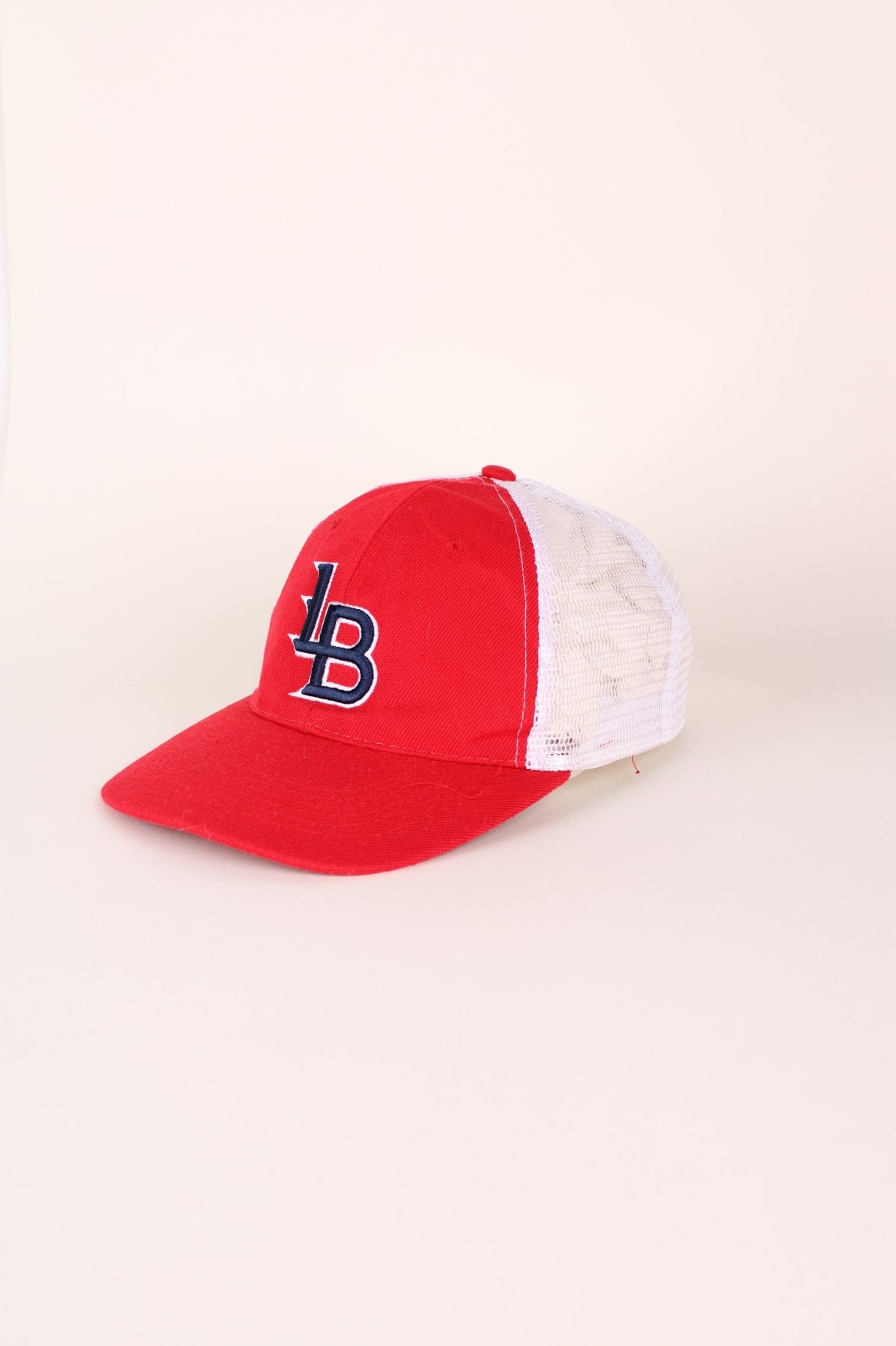 Vintage Louisville Bats Baseball cap in red and white with adjustable strap at the back.