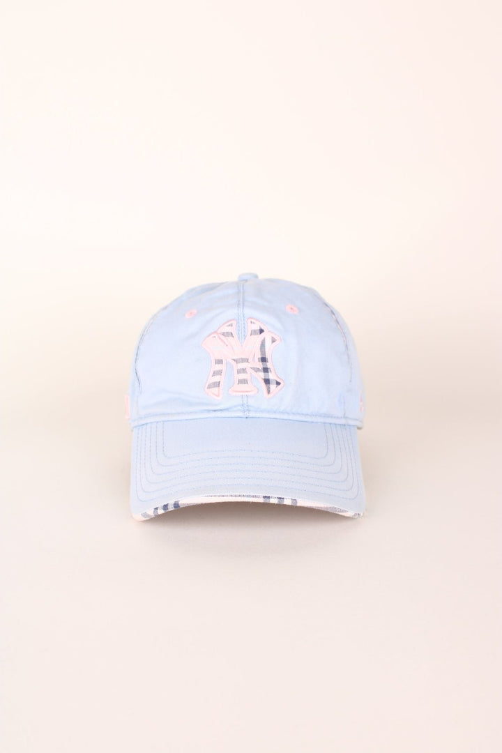 Vintage New York Yankees baseball cap in a blue and pink colourway with signature embroidered logo, check detailing and adjustable strap on the back.  