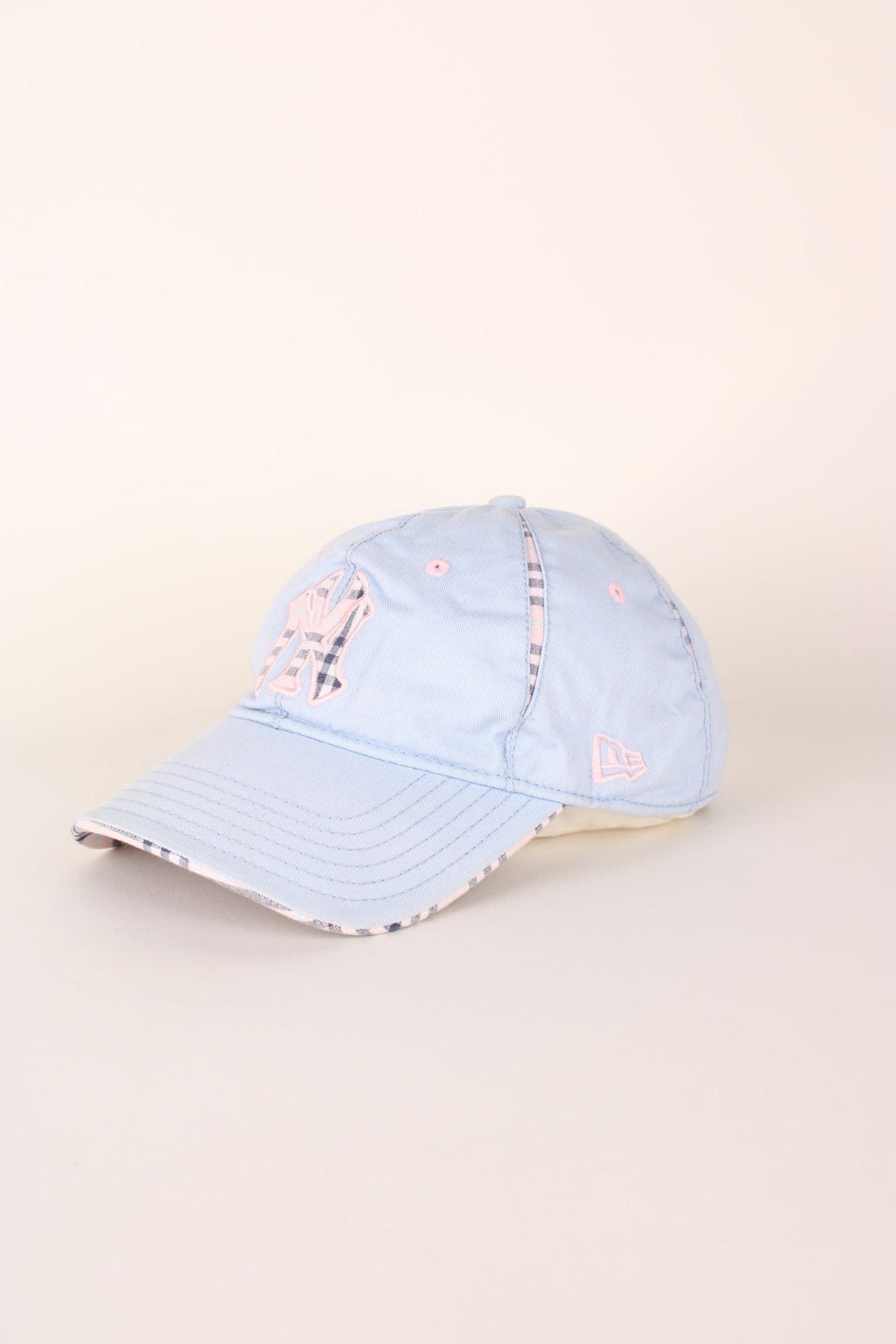 Vintage New York Yankees baseball cap in a blue and pink colourway with signature embroidered logo, check detailing and adjustable strap on the back.  