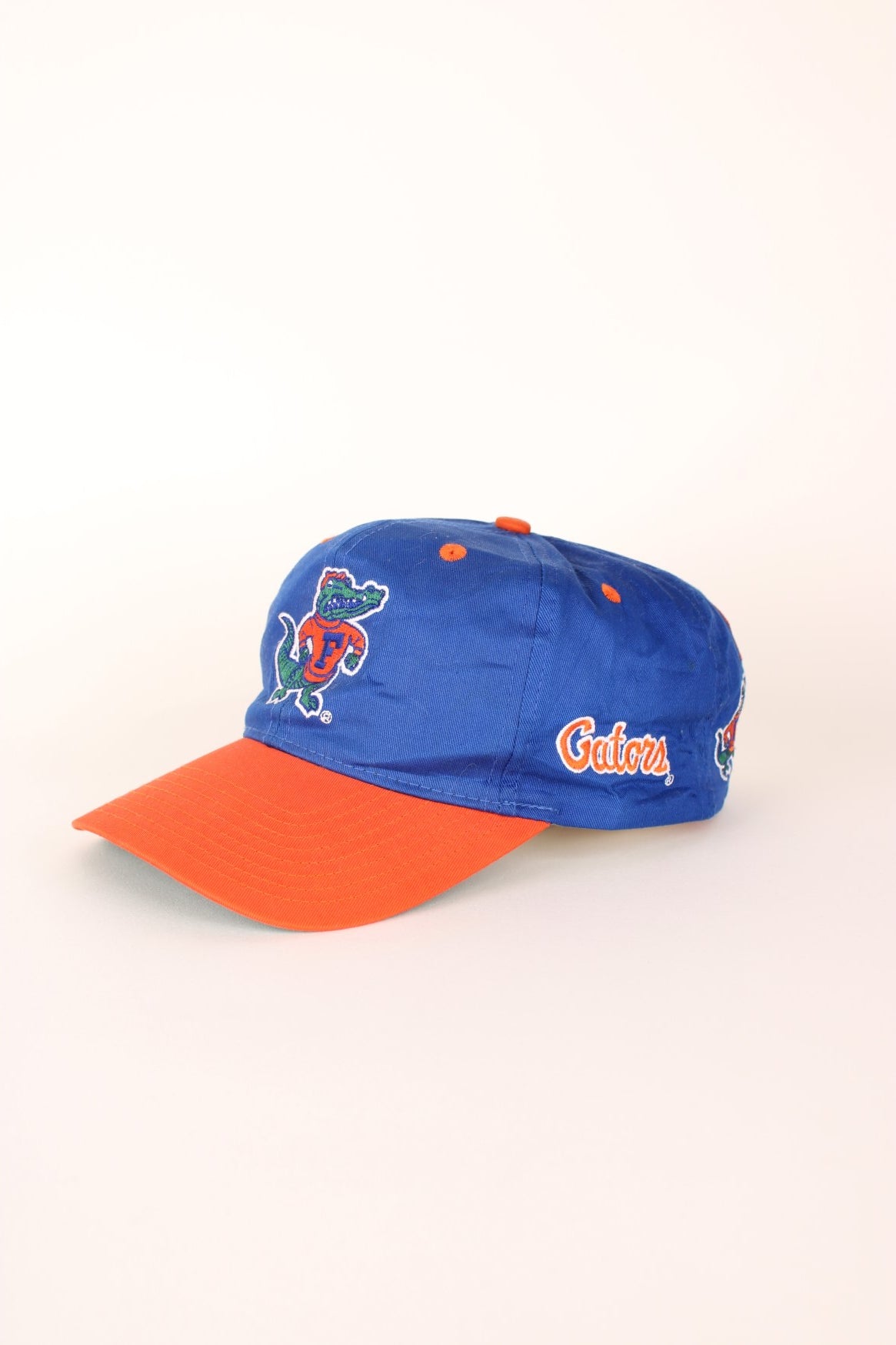 Vintage Florida Gators Cap in blue and orange with adjustable strap on the back. 