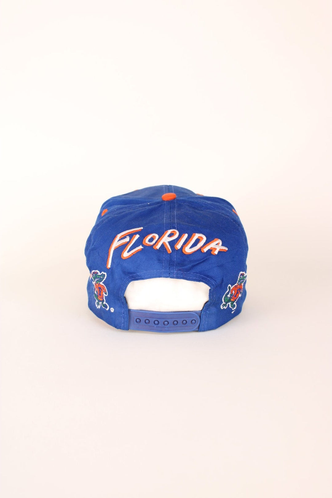 Vintage Florida Gators Cap in blue and orange with adjustable strap on the back. 