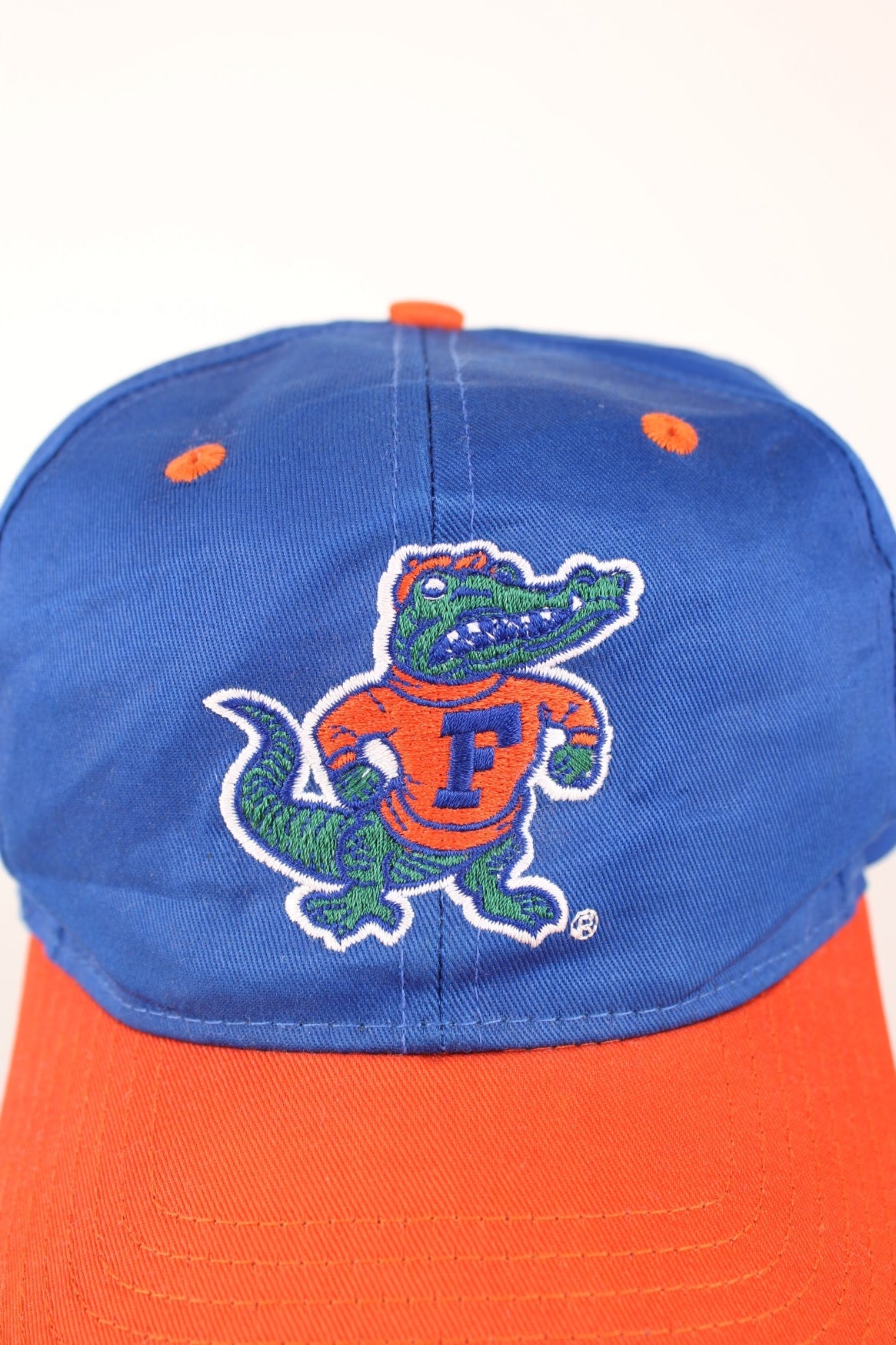 Vintage Florida Gators Cap in blue and orange with adjustable strap on the back. 