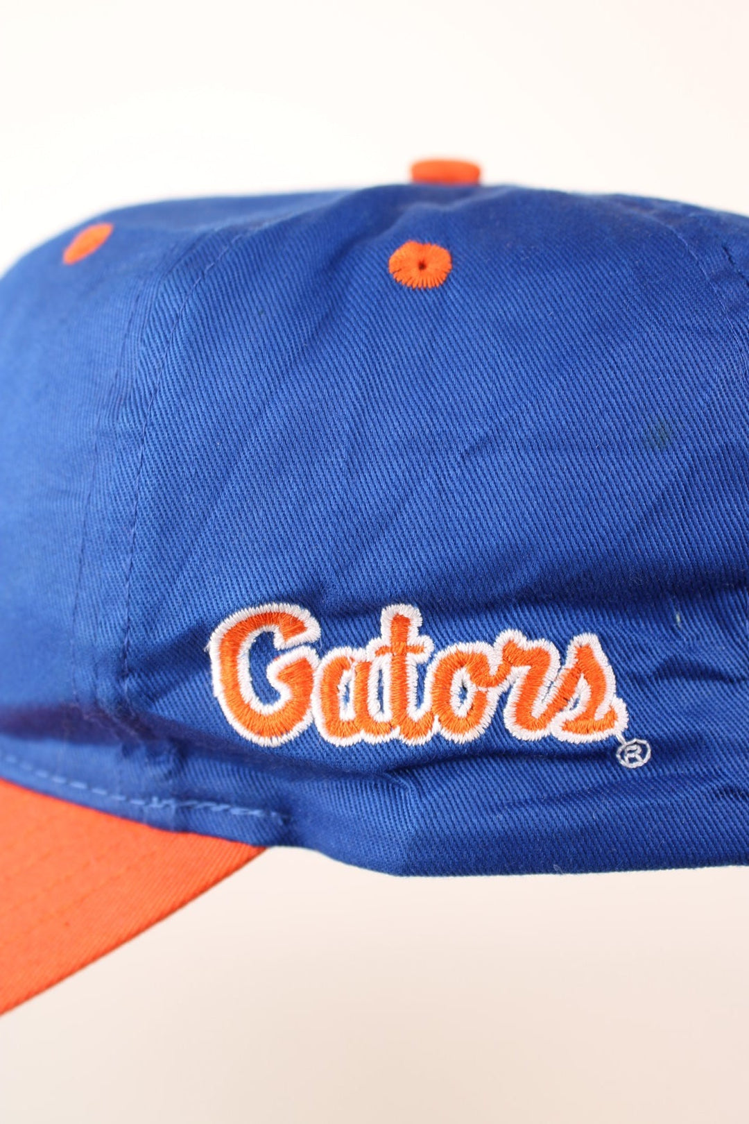 Vintage Florida Gators Cap in blue and orange with adjustable strap on the back. 