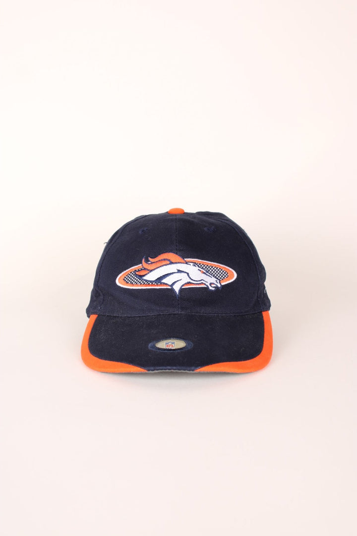 NFL Denver Broncos baseball cap in navy blue and orange with embroidered logo and adjustable velcro strap. 