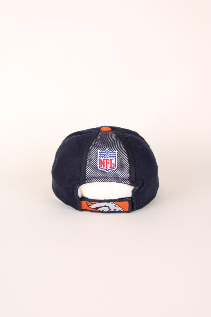 NFL Denver Broncos baseball cap in navy blue and orange with embroidered logo and adjustable velcro strap. 