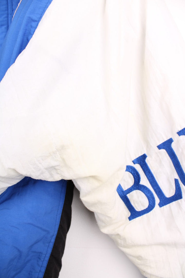 Toronto Blue Jays pro sport jacket in blue black and white. Zip and snap fastener closure with team logos embroidered on the front, back and sleeve.