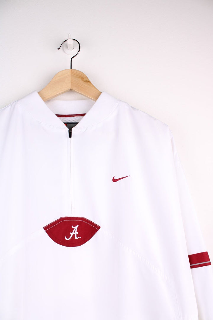 Alabama Crimson Tide  Windbreaker in a  colourway, quarter zip up and has a big pouch pocket, and the logos embroidered on the front.