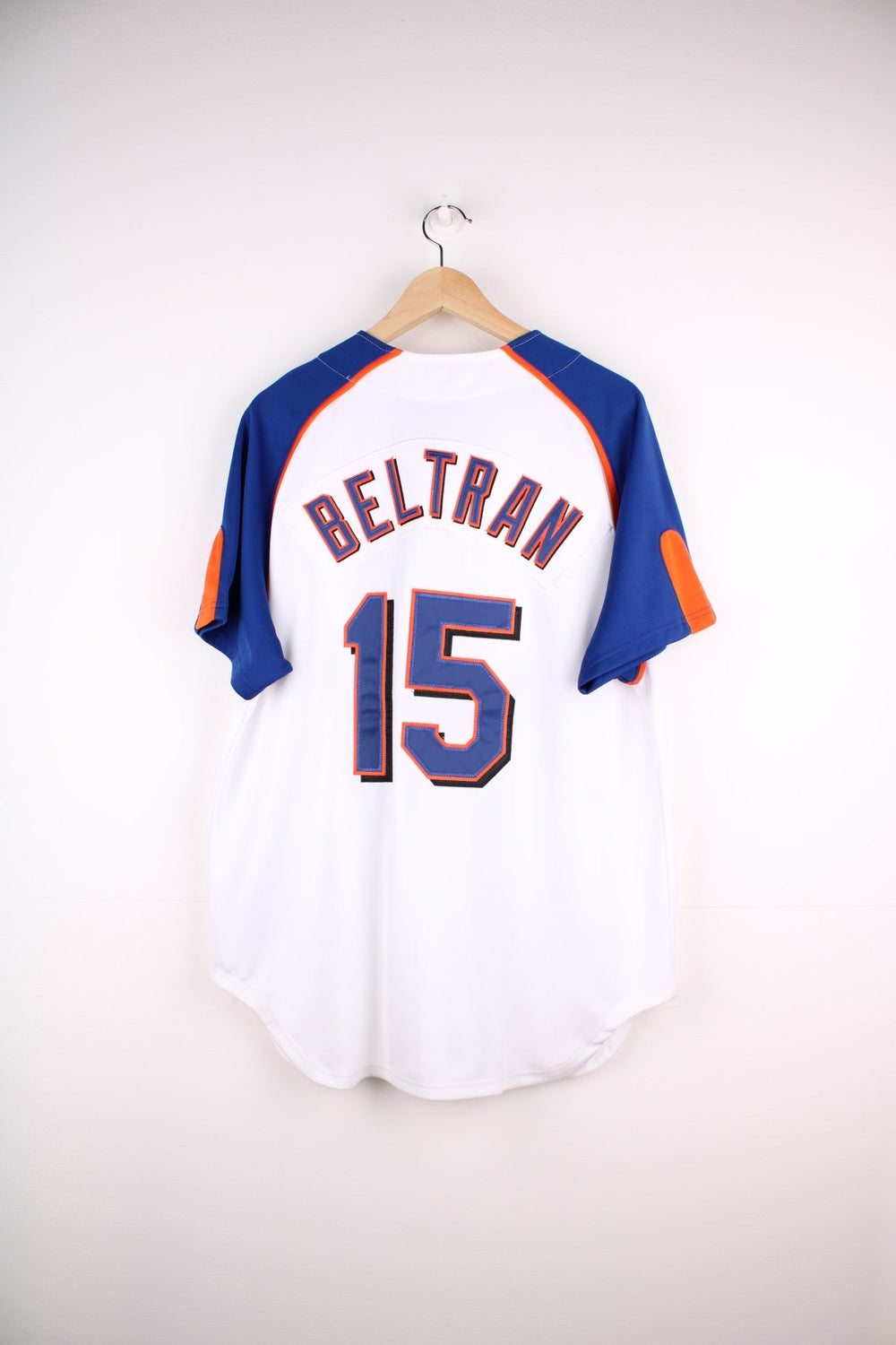 Nike New York Mets MLB jersey in white with blue sleeves and orange piping, Nike swoosh and team logo embrodiered on the front and Beltran no.15 on the back.