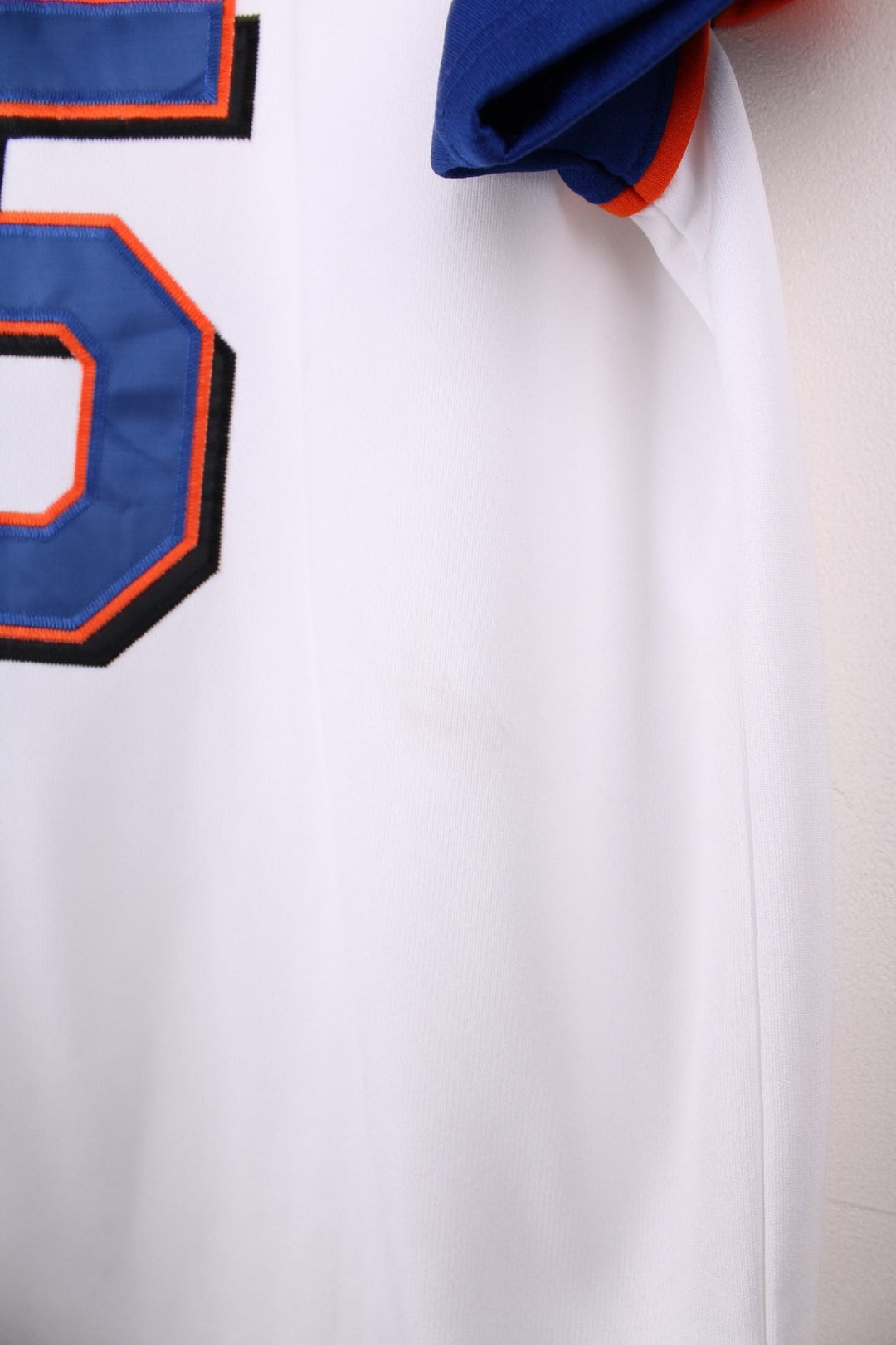 Nike New York Mets MLB jersey in white with blue sleeves and orange piping, Nike swoosh and team logo embrodiered on the front and Beltran no.15 on the back.