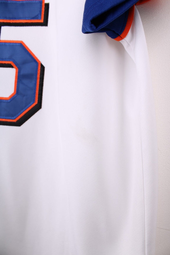 Nike New York Mets MLB jersey in white with blue sleeves and orange piping, Nike swoosh and team logo embrodiered on the front and Beltran no.15 on the back.