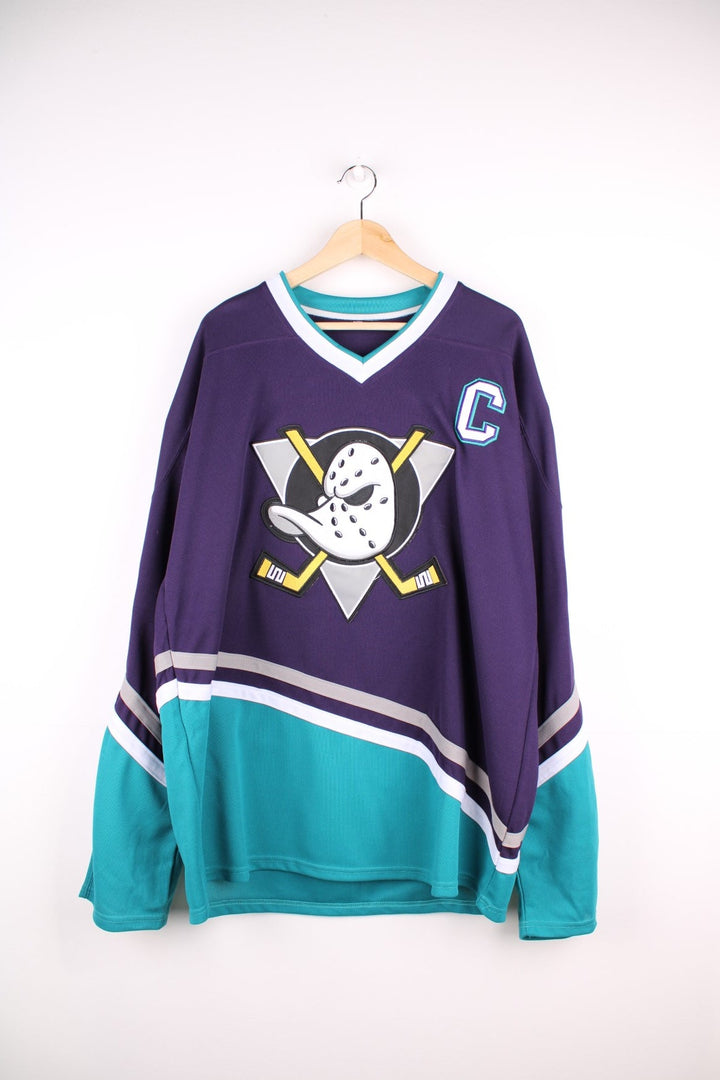 Anaheim Mighty Ducks NHL jersey in purple with blue and white stripe accents, features embroidered logos and no.96 Conway on the back.