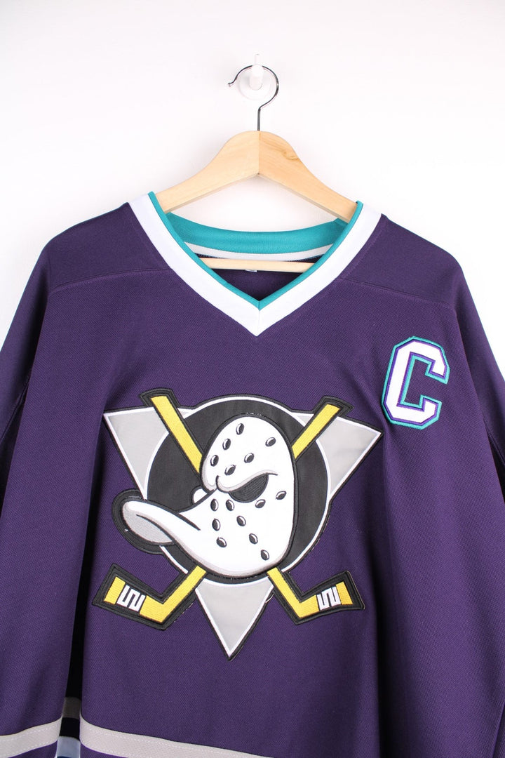 Anaheim Mighty Ducks NHL jersey in purple with blue and white stripe accents, features embroidered logos and no.96 Conway on the back.