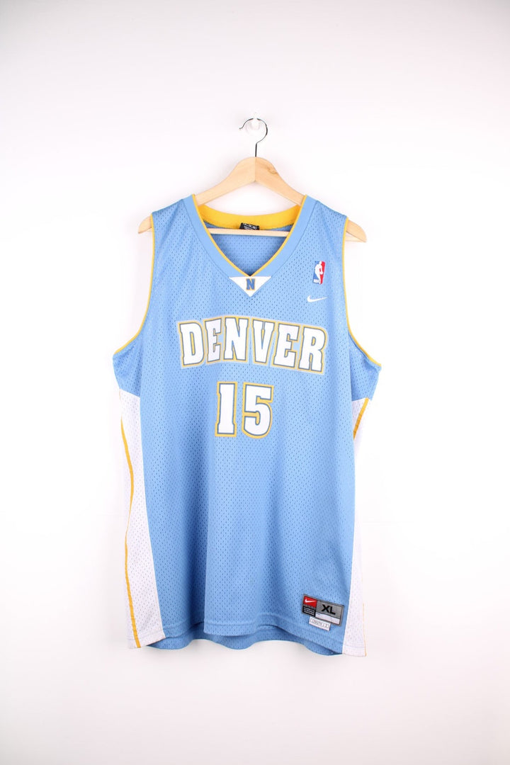 Denver Nuggets NBA in blue with yellow and white accents, multiple embroidered logos and no.15 Anthony on the back.