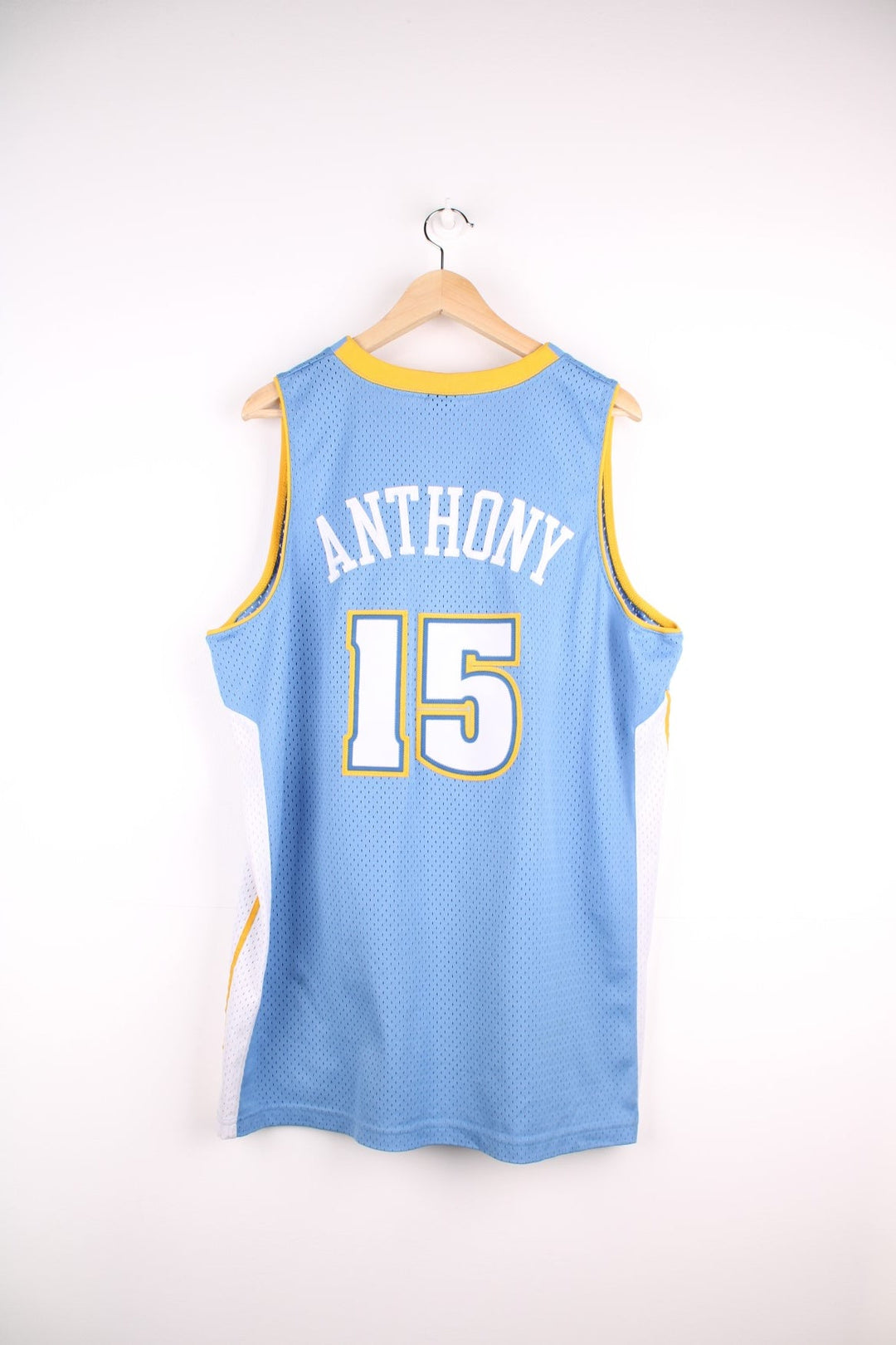 Denver Nuggets NBA in blue with yellow and white accents, multiple embroidered logos and no.15 Anthony on the back.