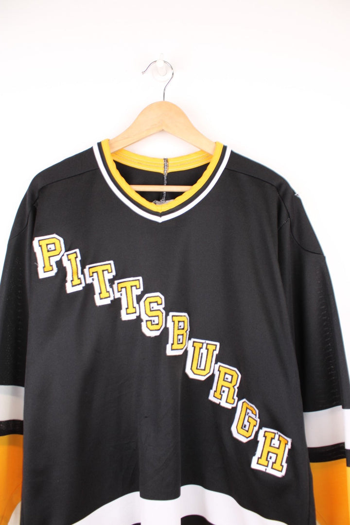 90s Pittsburgh Penguins CCM, NHL hockey jersey in a black, white and yellow colourway.