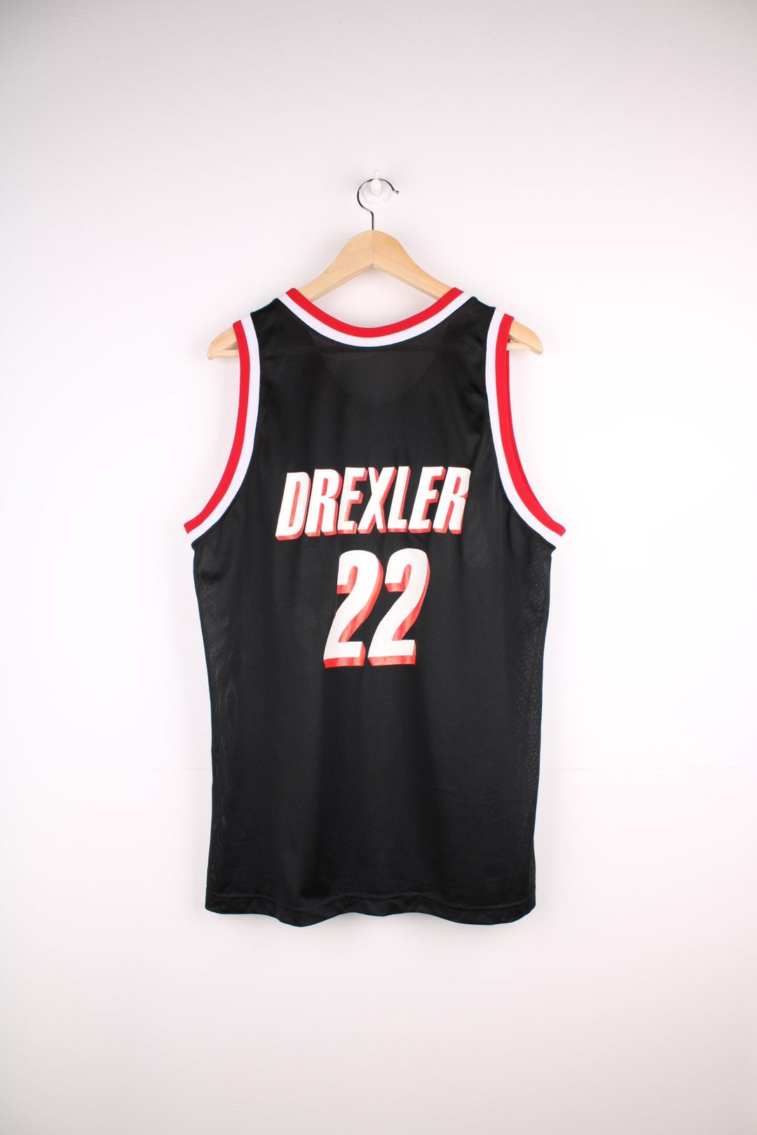 Portland Trail Blazers NBA jersey in black with red and white accents, multiple embroidered logos, and no.22 Drexler on the back.