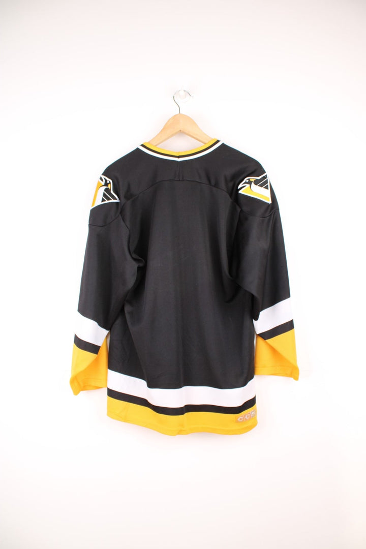 90s Pittsburgh Penguins CCM, NHL hockey jersey in a black, white and yellow colourway.