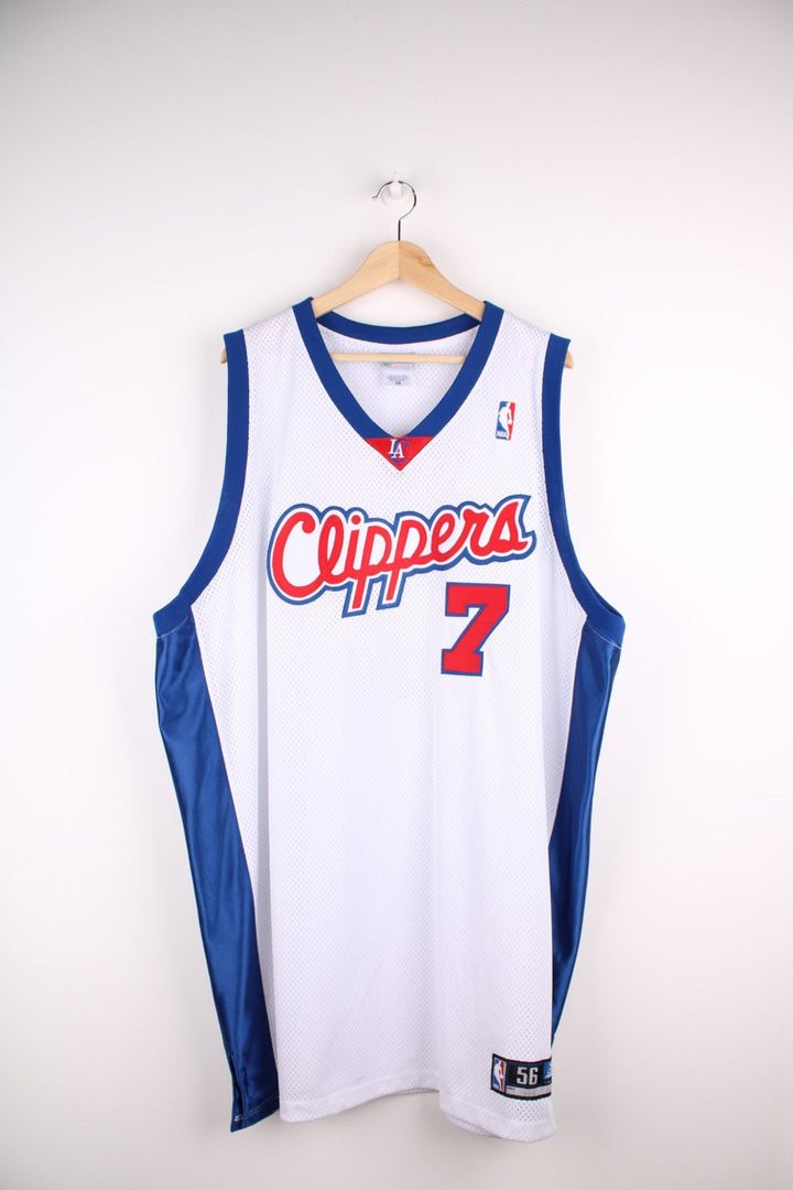 LA Clippers NBA jersey in white with blue and red accents, multiple embroidered logos, and no.7 Odom on the back.