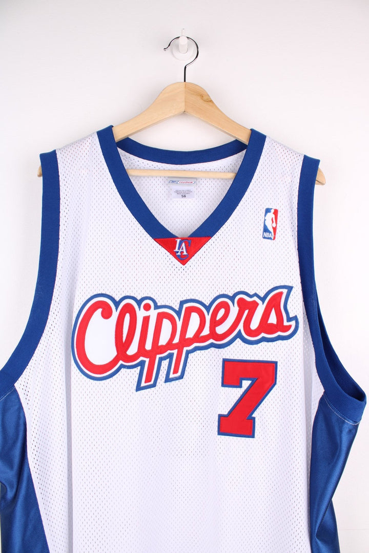 LA Clippers NBA jersey in white with blue and red accents, multiple embroidered logos, and no.7 Odom on the back.