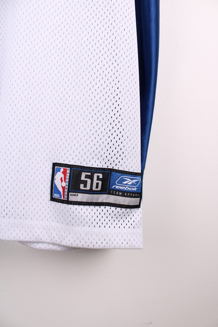 LA Clippers NBA jersey in white with blue and red accents, multiple embroidered logos, and no.7 Odom on the back.