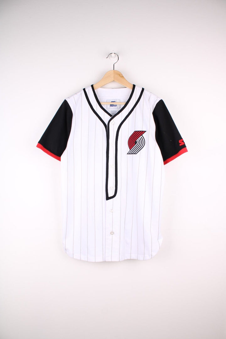 Portland Trail Blazers NBA button-up jersey in white with grey stripes and black and red accents, embroidered logos on the front and sleeve and team spellout on the back.