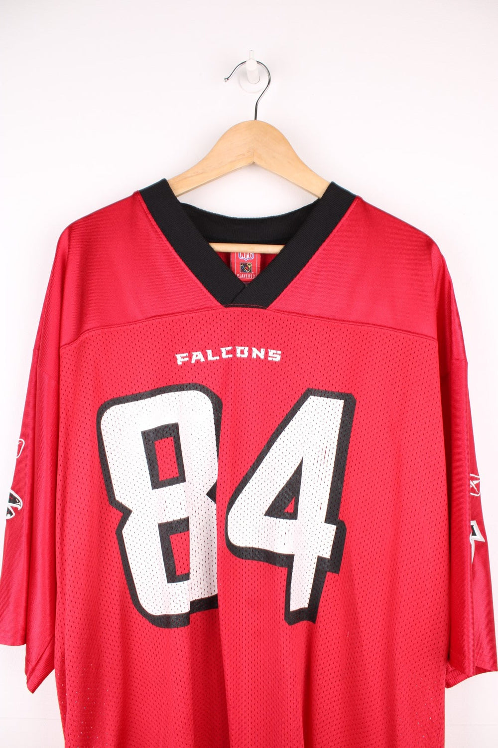 Atlanta Falcons, White #84, Reebok NFL Jersey. Features printed Falcons 84 on the front, and printed logos on both sleeves.