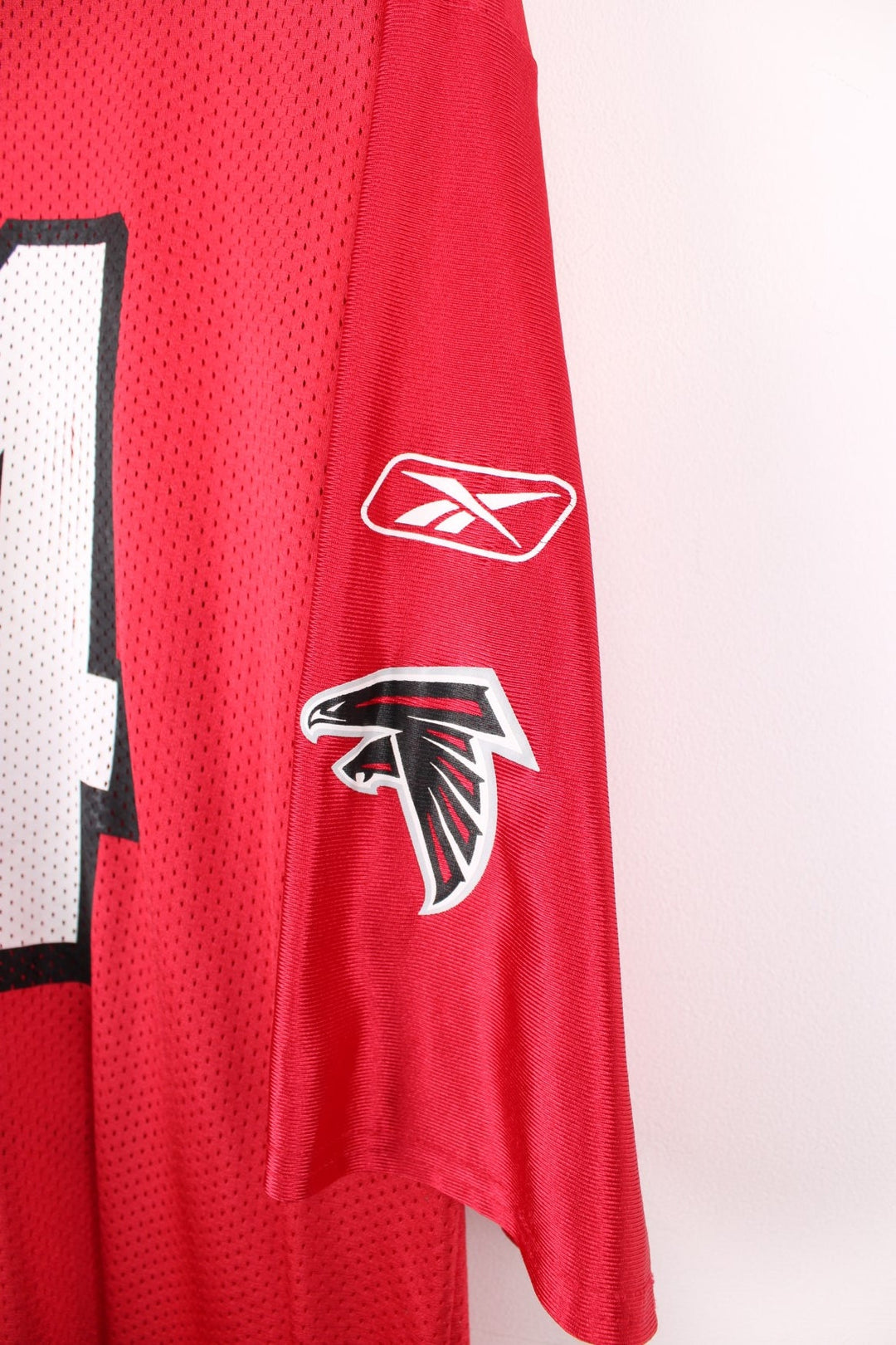 Atlanta Falcons, White #84, Reebok NFL Jersey. Features printed Falcons 84 on the front, and printed logos on both sleeves.