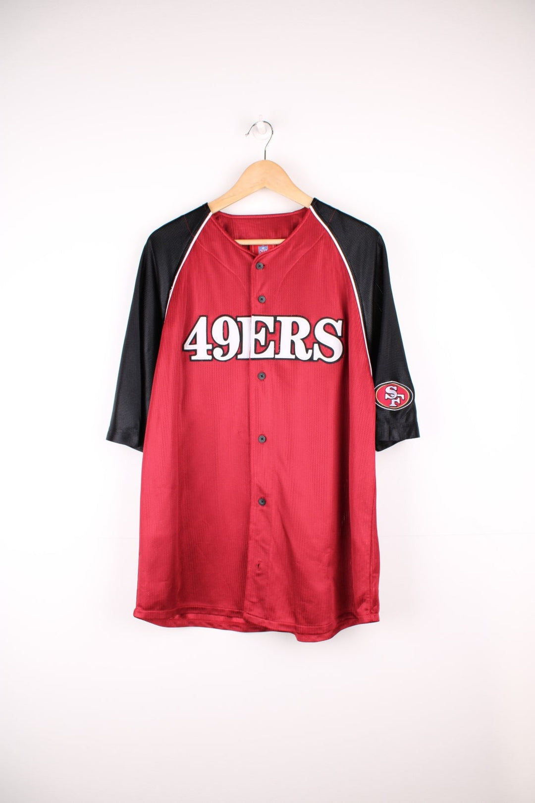 NFL San Francisco 49ers button up jersey in black and red with embroidered spell out logo across the front.