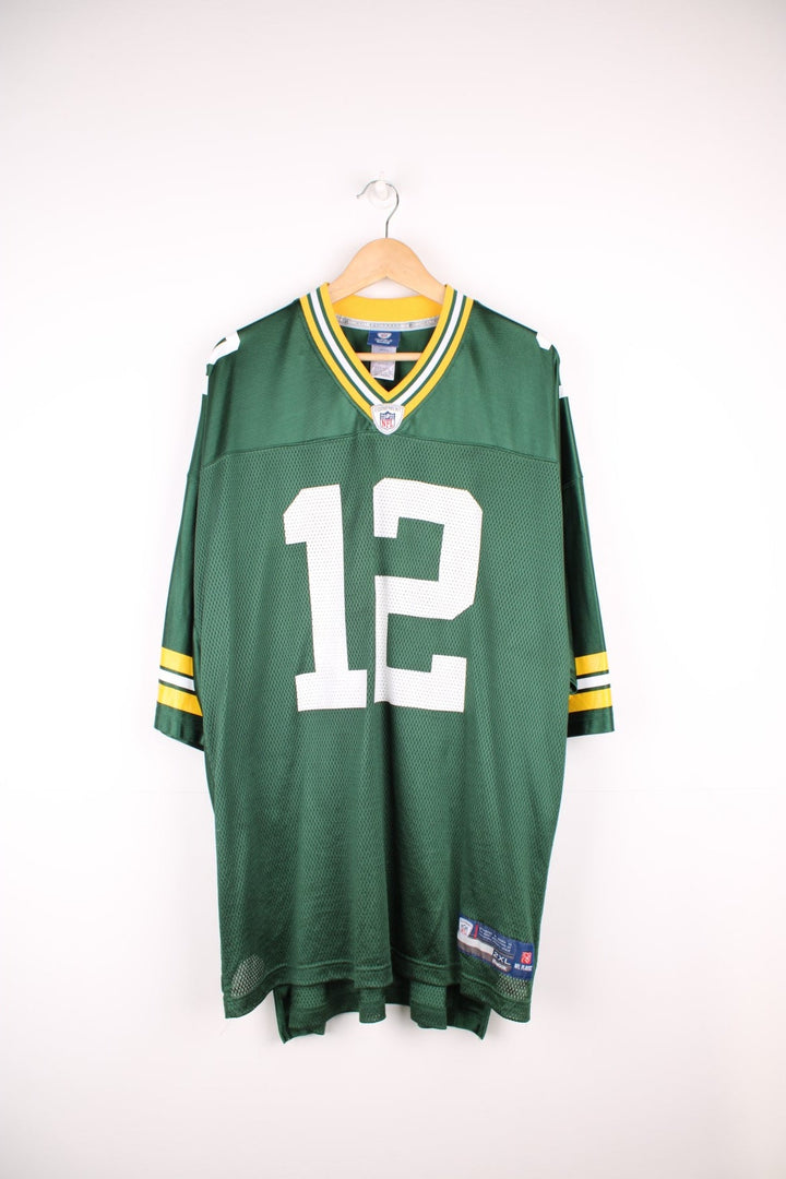 Reebok Green Bay Packers, Rodgers #12 NFL jersey. Features printed 12 on the front and back, and Reebok logo on the sleeves.