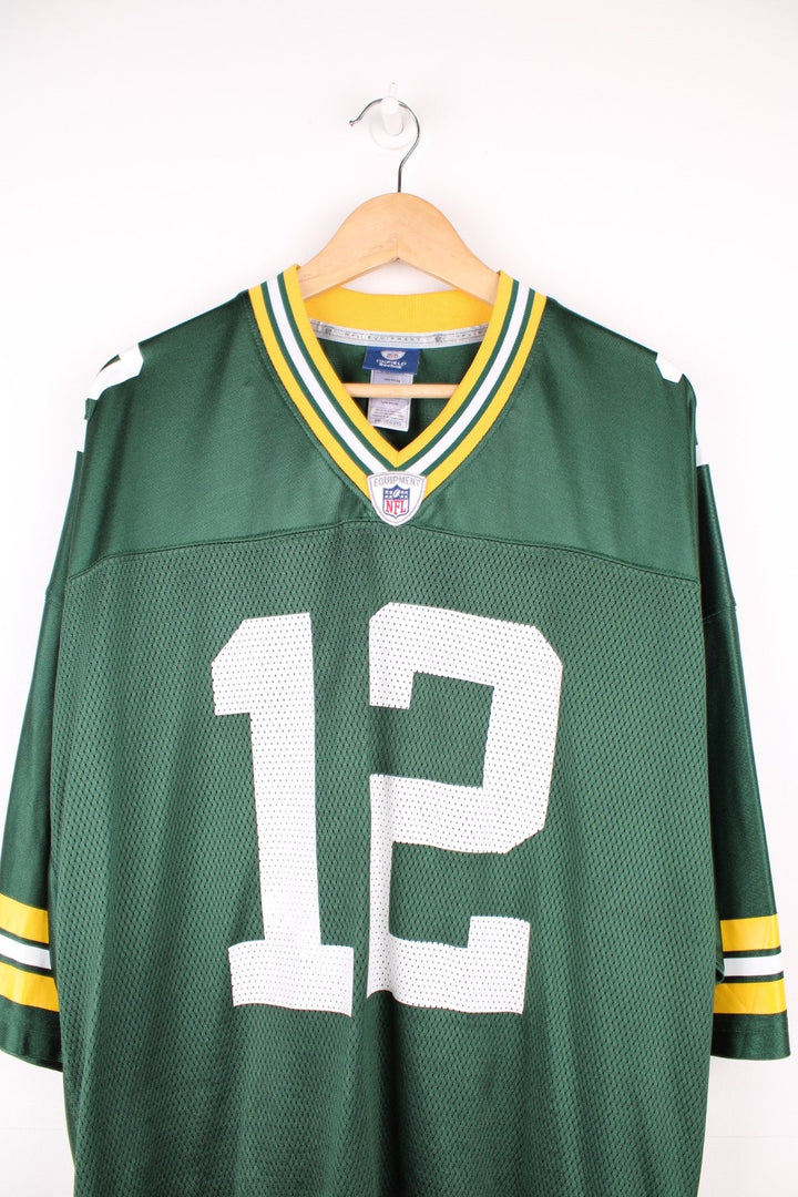 Reebok Green Bay Packers, Rodgers #12 NFL jersey. Features printed 12 on the front and back, and Reebok logo on the sleeves.