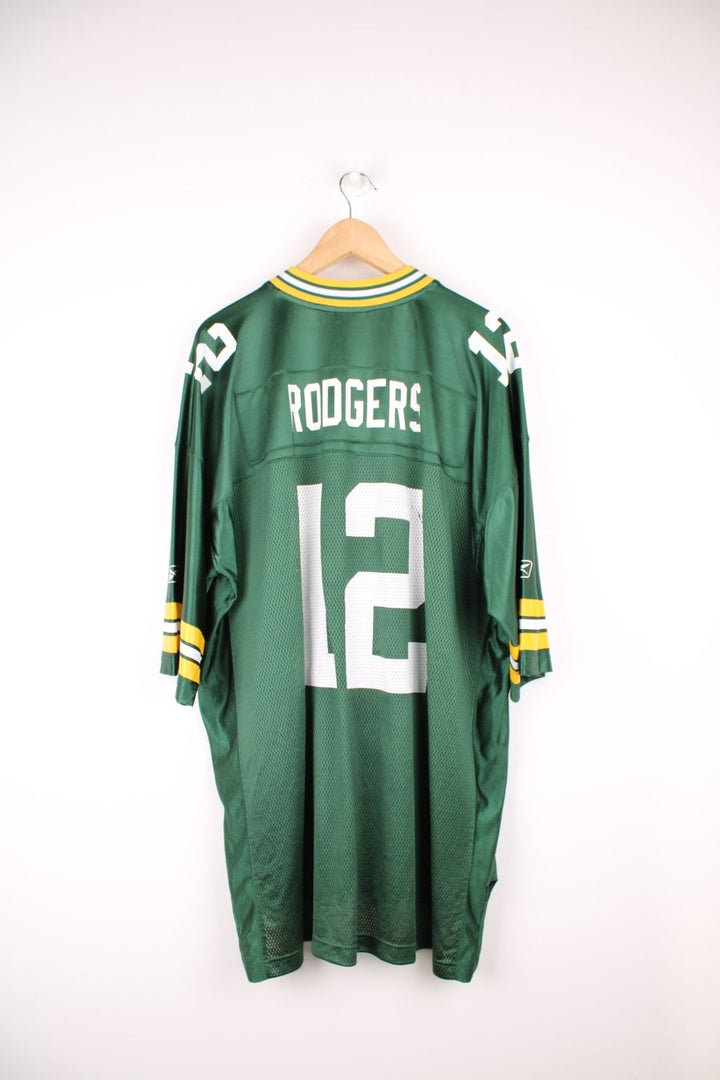 Reebok Green Bay Packers, Rodgers #12 NFL jersey. Features printed 12 on the front and back, and Reebok logo on the sleeves.