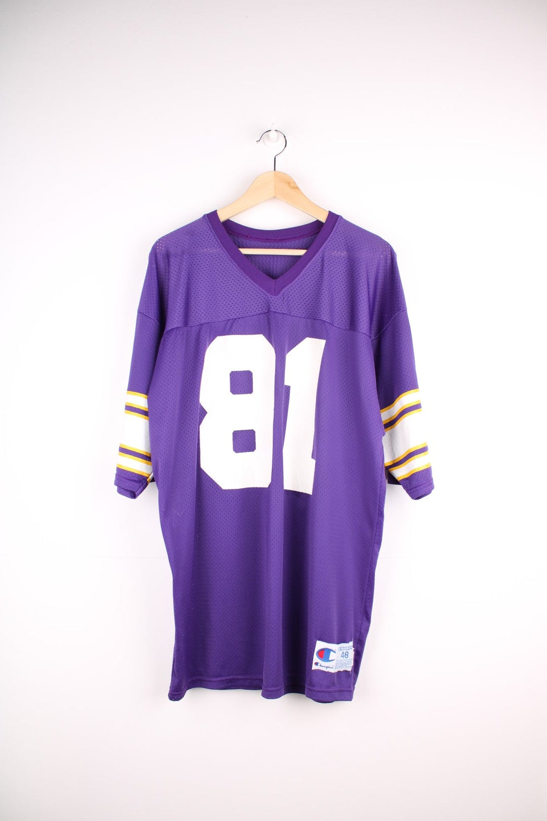  Champion Minnesota Vikings NFL jersey in purple with yellow and white accent stripes, an embroidered logo on the sleeve, and no.81 on the front, back and each sleeve.